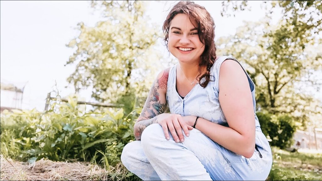 Woman sitting in a garden.