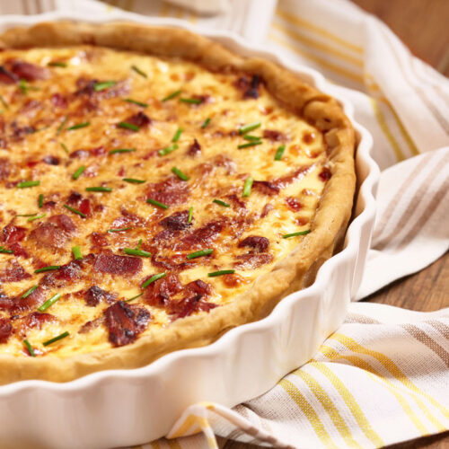 Quiche recipe in a white pie pan.