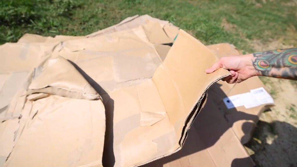 A pile of carboard for preparing garden beds.