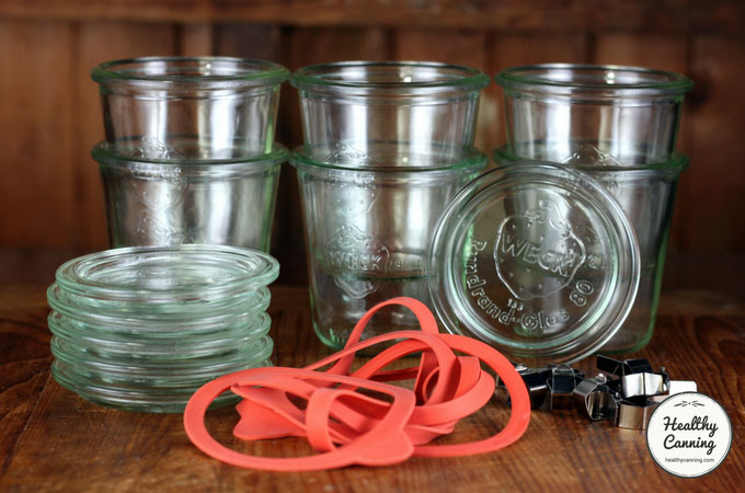 A stack of glass weck jar canning lids.