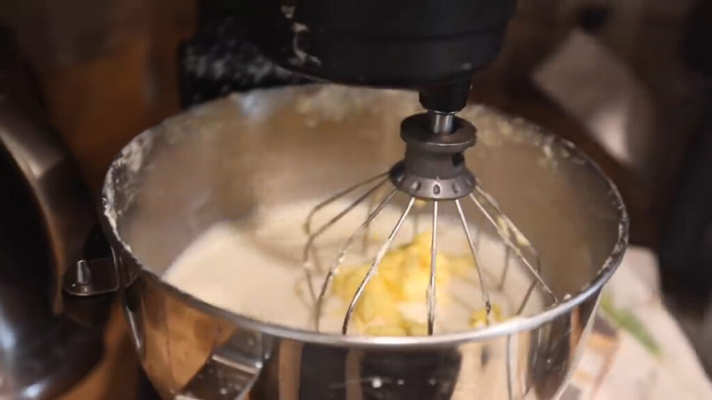 Butter separated from buttermilk in a stand mixer.