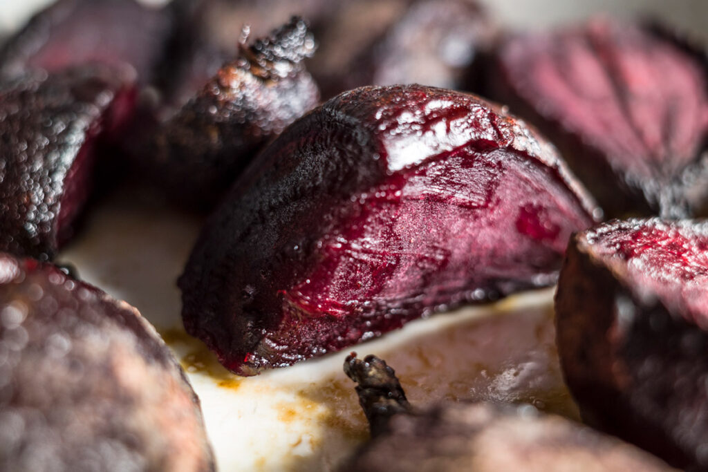 Roasted beets on parchment paper.