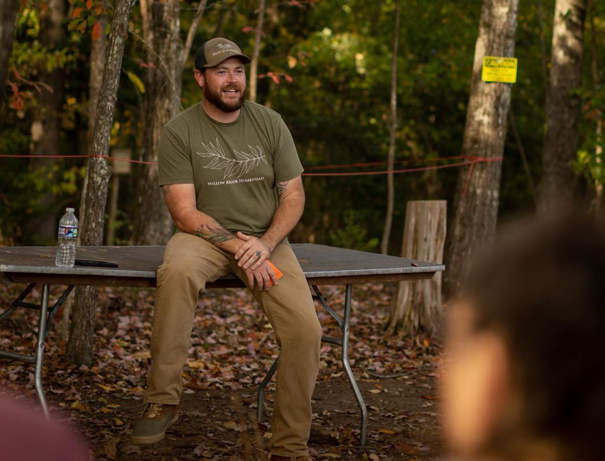 A man sitting on a trampoline.